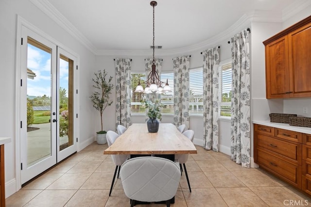 25032 Trilogy Trail Ln, Murrieta, CA 92562 - dining area with crown molding, baseboards, light tile patterned floors, and a chandelier