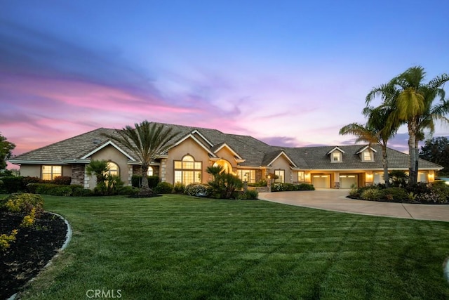 25032 Trilogy Trail Ln, Murrieta, CA 92562 - view of front of property featuring a lawn, stucco siding, and driveway