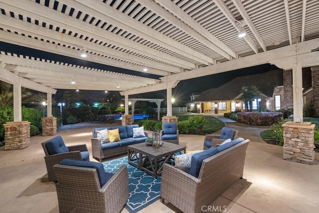 25032 Trilogy Trail Ln, Murrieta, CA 92562 - patio at night with a pergola and an outdoor living space