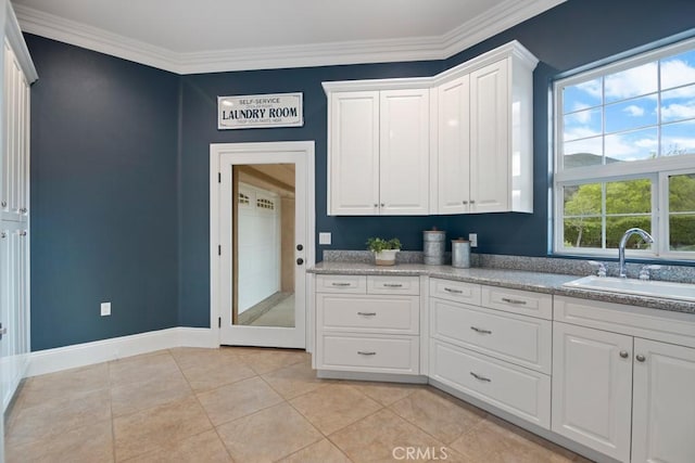 25032 Trilogy Trail Ln, Murrieta, CA 92562 - kitchen featuring a sink, baseboards, ornamental molding, and white cabinetry