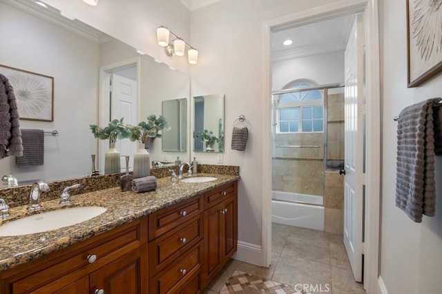25032 Trilogy Trail Ln, Murrieta, CA 92562 - bathroom featuring crown molding, double vanity, and a sink