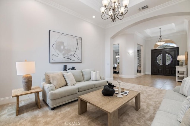 25032 Trilogy Trail Ln, Murrieta, CA 92562 - living room with visible vents, arched walkways, baseboards, a chandelier, and a tray ceiling