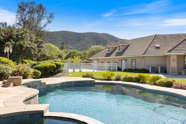 25032 Trilogy Trail Ln, Murrieta, CA 92562 - view of pool with a lawn, central air condition unit, fence, a mountain view, and a patio