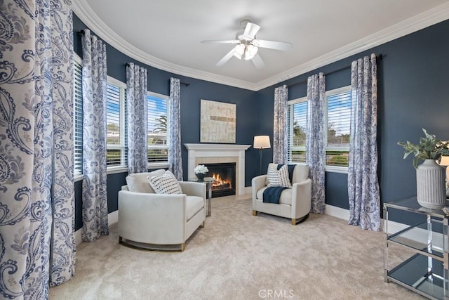 25032 Trilogy Trail Ln, Murrieta, CA 92562 - sitting room featuring crown molding, a ceiling fan, a tiled fireplace, and a wealth of natural light