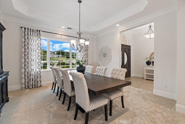 25032 Trilogy Trail Ln, Murrieta, CA 92562 - dining area with visible vents, ornamental molding, a tray ceiling, and light carpet