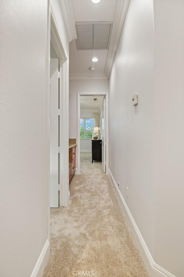 25032 Trilogy Trail Ln, Murrieta, CA 92562 - hall with visible vents, ornamental molding, baseboards, attic access, and light colored carpet