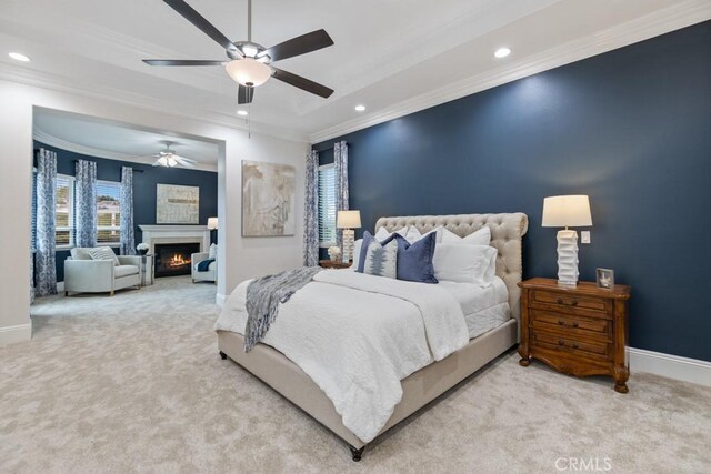 25032 Trilogy Trail Ln, Murrieta, CA 92562 - carpeted bedroom featuring crown molding, baseboards, recessed lighting, and a warm lit fireplace