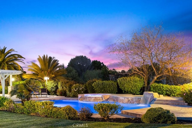 25032 Trilogy Trail Ln, Murrieta, CA 92562 - pool at dusk featuring a pool with connected hot tub