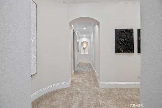 25032 Trilogy Trail Ln, Murrieta, CA 92562 - hall featuring baseboards, arched walkways, and carpet flooring