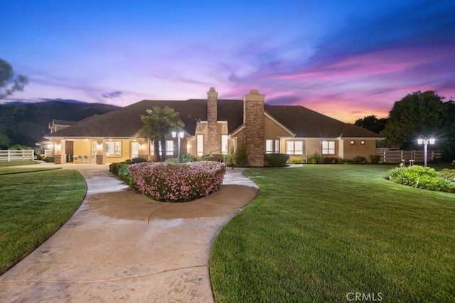 25032 Trilogy Trail Ln, Murrieta, CA 92562 - front of property featuring fence, a chimney, and a front lawn