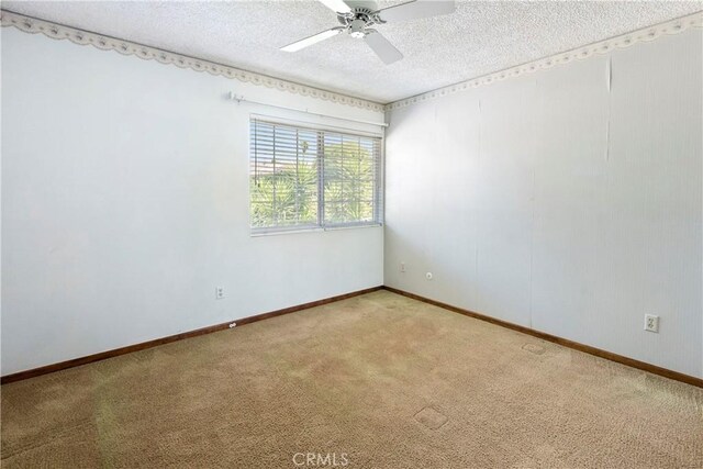 5655 Via Mensabe, Riverside, CA 92506 - unfurnished room with light colored carpet, a textured ceiling, ceiling fan, and baseboards