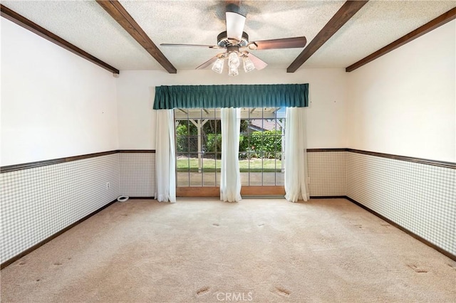 5655 Via Mensabe, Riverside, CA 92506 - unfurnished room with beam ceiling, carpet, a textured ceiling, ceiling fan, and a wainscoted wall