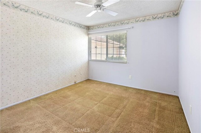 5655 Via Mensabe, Riverside, CA 92506 - carpeted empty room with a textured ceiling, wallpapered walls, ceiling fan, and baseboards