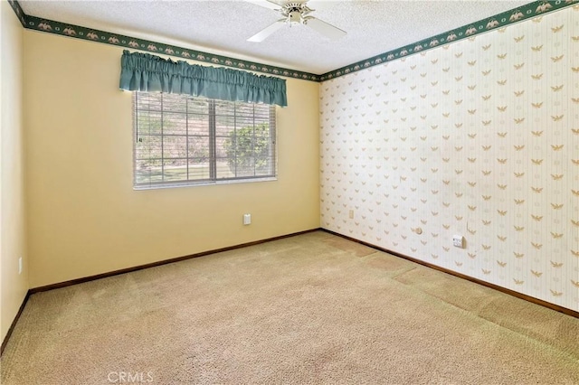 5655 Via Mensabe, Riverside, CA 92506 - spare room featuring carpet flooring, a textured ceiling, wallpapered walls, baseboards, and ceiling fan