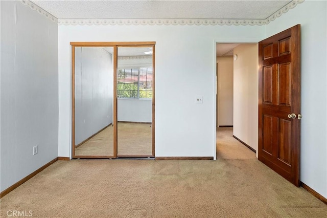 5655 Via Mensabe, Riverside, CA 92506 - unfurnished bedroom featuring light colored carpet, baseboards, and a closet