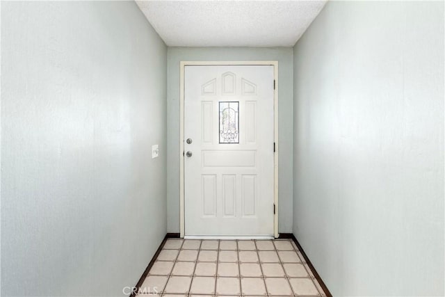 5655 Via Mensabe, Riverside, CA 92506 - doorway with baseboards, light flooring, and a textured ceiling