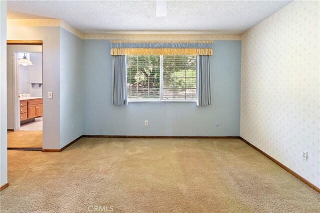 5655 Via Mensabe, Riverside, CA 92506 - carpeted empty room with a textured ceiling and wallpapered walls