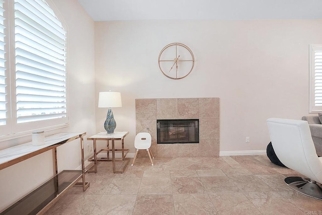 1693 Thompson Ave, Chula Vista, CA 91913 - sitting room featuring plenty of natural light, light stone finish floors, and a tile fireplace