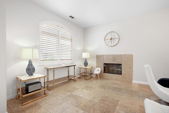 1693 Thompson Ave, Chula Vista, CA 91913 - sitting room featuring stone finish floors and a tiled fireplace