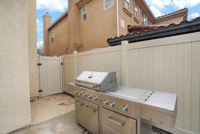 1693 Thompson Ave, Chula Vista, CA 91913 - view of patio / terrace with a gate and exterior kitchen