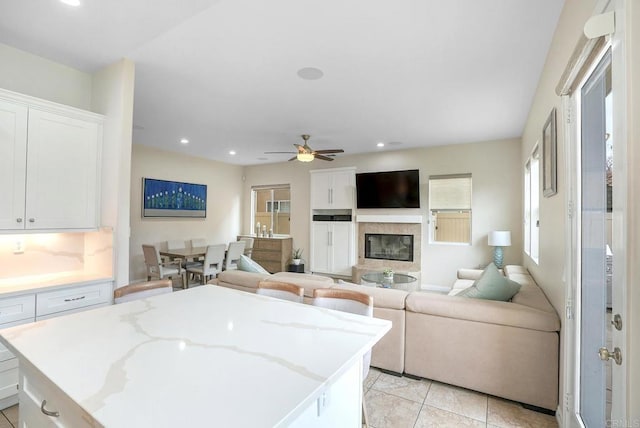 1693 Thompson Ave, Chula Vista, CA 91913 - kitchen featuring open floor plan, white cabinets, a center island, ceiling fan, and recessed lighting