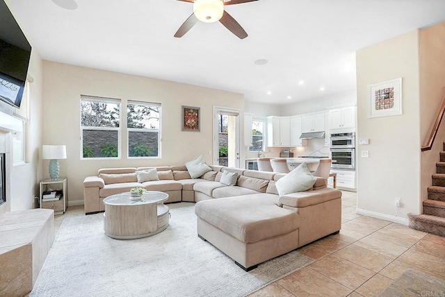 1693 Thompson Ave, Chula Vista, CA 91913 - living area with stairway, ceiling fan, light tile patterned floors, recessed lighting, and a high end fireplace