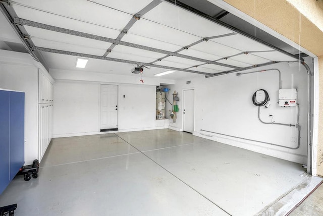 1693 Thompson Ave, Chula Vista, CA 91913 - garage with a garage door opener and secured water heater