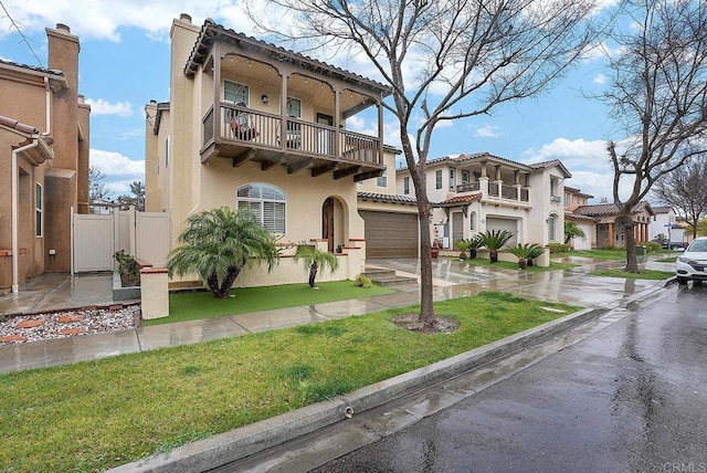 1693 Thompson Ave, Chula Vista, CA 91913 - view of front of house featuring a balcony, stucco siding, driveway, a front lawn, and a residential view
