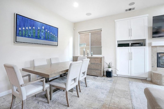 1693 Thompson Ave, Chula Vista, CA 91913 - dining space featuring a tile fireplace and light tile patterned floors