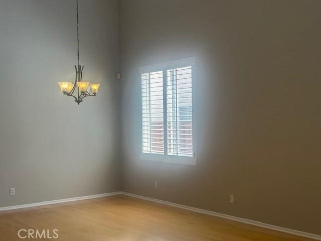 31329 Seminole St, Temecula, CA 92591 - unfurnished room featuring a chandelier, plenty of natural light, and light wood-type flooring