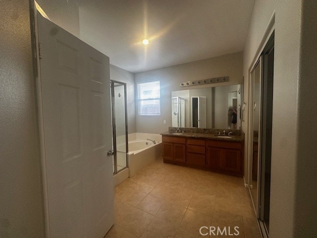 31329 Seminole St, Temecula, CA 92591 - bathroom with a garden tub, a shower stall, double vanity, and tile patterned floors