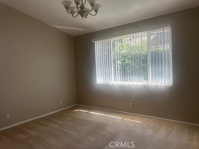 31329 Seminole St, Temecula, CA 92591 - empty room featuring a chandelier and carpet flooring