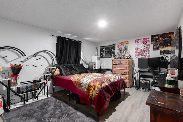 323 Whipple Mountain Rd, San Bernardino, CA 92410 - bedroom featuring a textured ceiling and wood finished floors