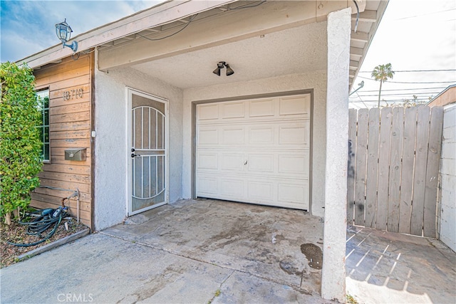 garage featuring fence
