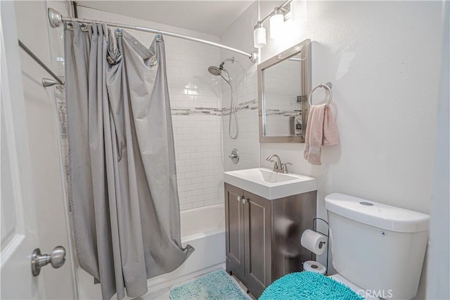 full bath with vanity, toilet, and shower / tub combo with curtain