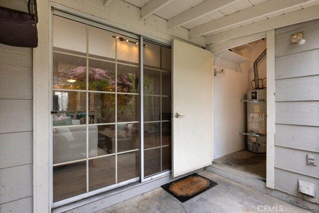 entrance to property featuring secured water heater