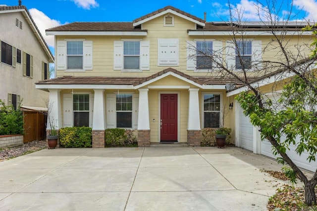 31746 Palomar Rd, Menifee, CA 92584 - view of front facade with brick siding, roof mounted solar panels, a garage, and concrete driveway