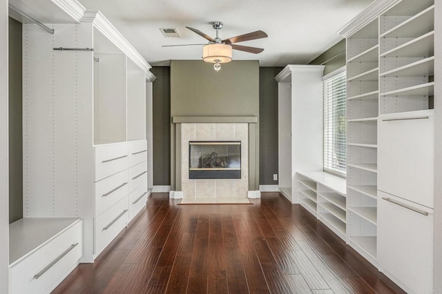 31746 Palomar Rd, Menifee, CA 92584 - walk in closet with ceiling fan, wood-type flooring, and a fireplace