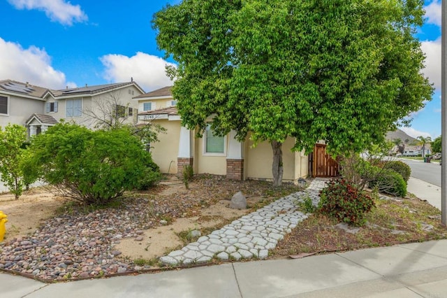 31746 Palomar Rd, Menifee, CA 92584 - view of property hidden behind natural elements featuring stucco siding