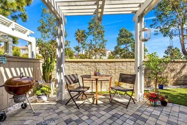 view of patio / terrace featuring fence, grilling area, and a pergola