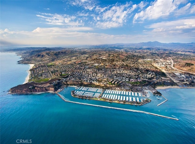 drone / aerial view with a water and mountain view