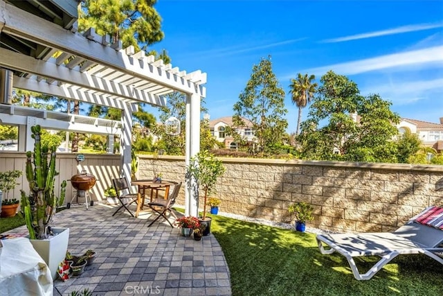 view of patio / terrace featuring a pergola and a fenced backyard