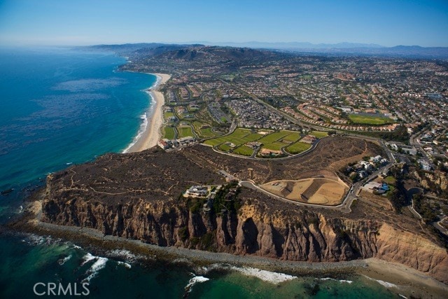 aerial view featuring a water and mountain view