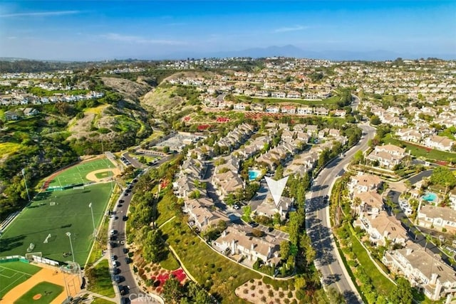 birds eye view of property with a residential view