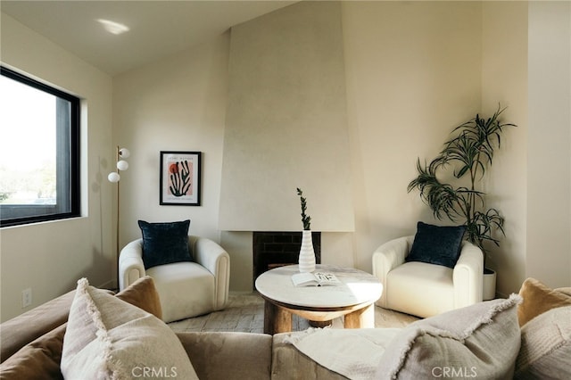 6144 W 76th St, Los Angeles, CA 90045 - living area with lofted ceiling, wood finished floors, and a fireplace