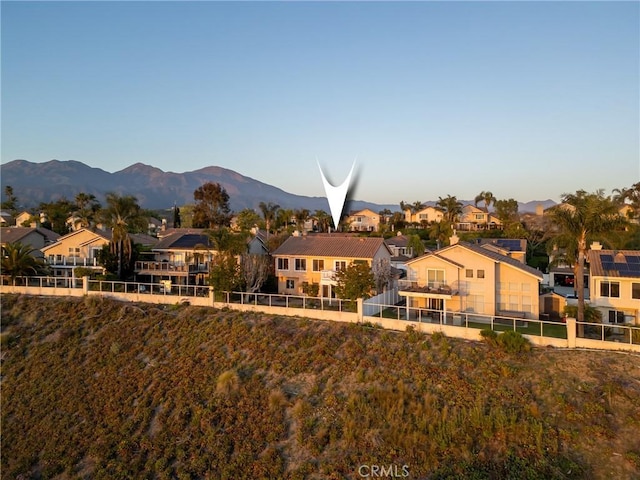 43 La Sordina, Rancho Santa Margarita, CA 92688 - back of house featuring a residential view, fence, and a mountain view