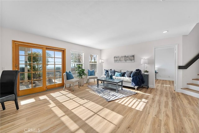 43 La Sordina, Rancho Santa Margarita, CA 92688 - living area featuring light wood-type flooring, stairway, baseboards, and recessed lighting