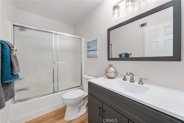 43 La Sordina, Rancho Santa Margarita, CA 92688 - bathroom with wood finished floors, toilet, vanity, and enclosed tub / shower combo