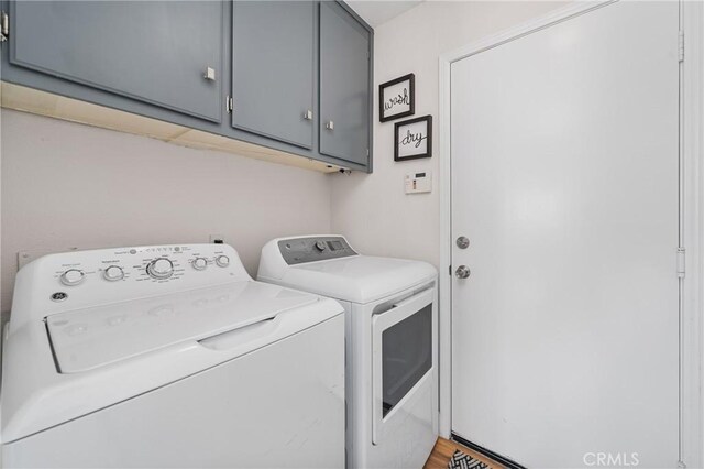 43 La Sordina, Rancho Santa Margarita, CA 92688 - clothes washing area featuring washing machine and clothes dryer and cabinet space