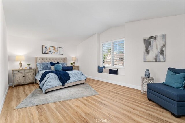 43 La Sordina, Rancho Santa Margarita, CA 92688 - bedroom featuring light wood-type flooring, baseboards, and lofted ceiling
